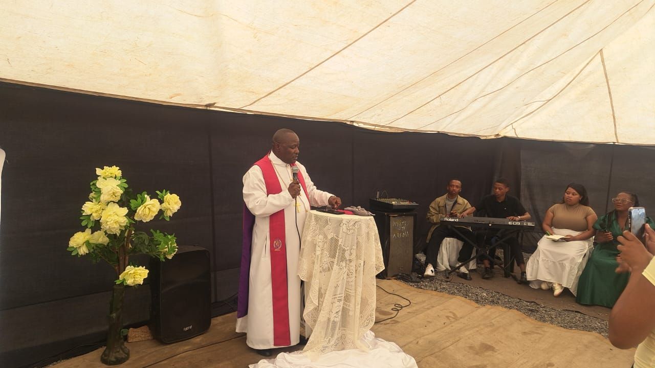 The Sunday service on 4 October in the church tent, with the congregation and band in the background